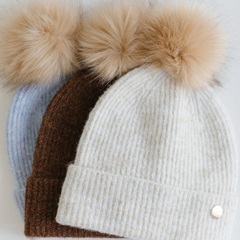 blue, brown, cream beanies with poms
