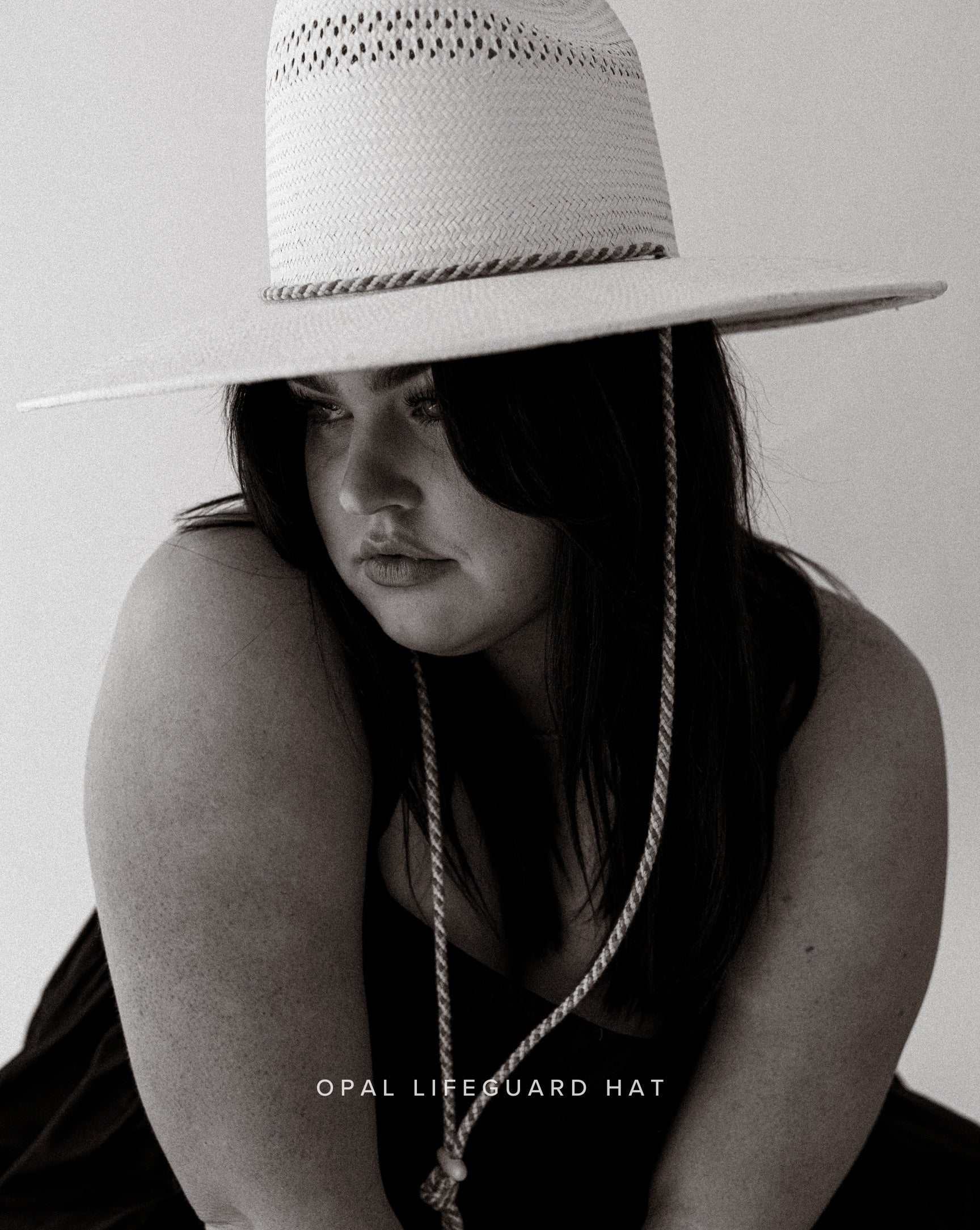 woman wearing opal lifeguard straw hat