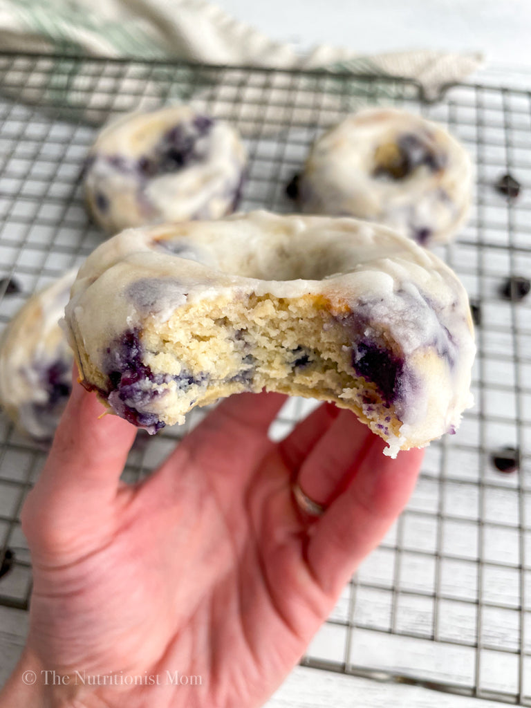 closeup bite Blueberry GlazedProtein Donuts