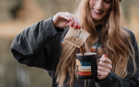 Instant Adventure Specialty Instant Coffee poured into camp mug