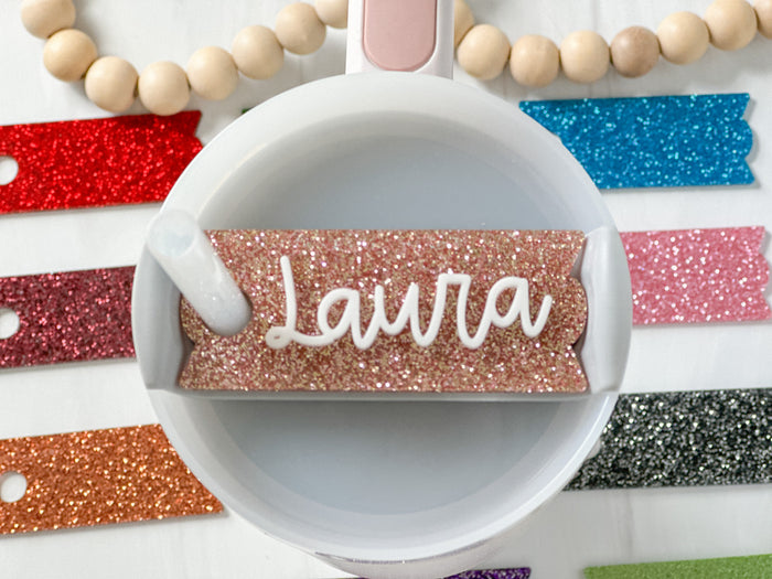 https://cdn.shopify.com/s/files/1/0431/9363/0878/files/GlitterStanleyNameTag.jpg?v=1700067435&width=700