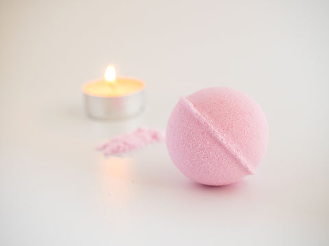 bath bomb with candle in background