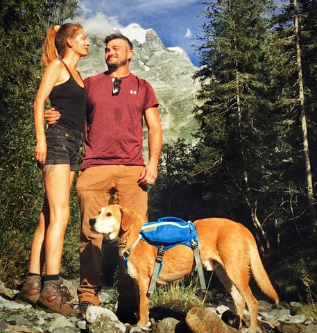 DOGPAK founders hiking with their dog wearing a K9 backpack in the Swiss Alps