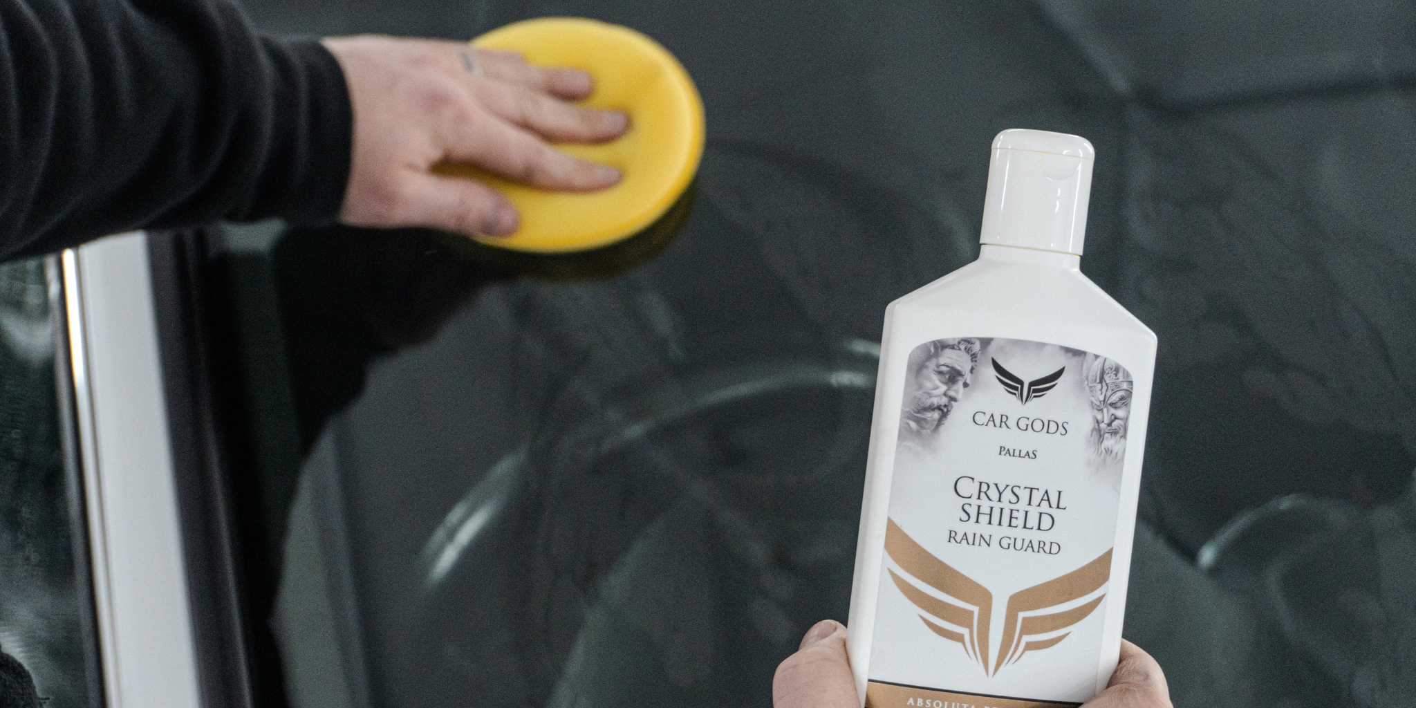 Car Gods Crystal Shield Rain Guard being applied to a windscreen