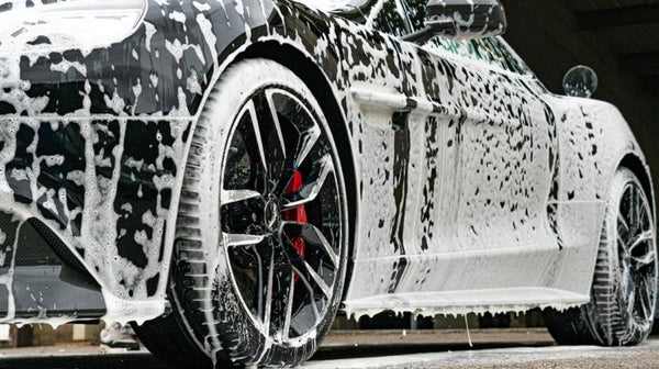 Car dripping with Snow Foam