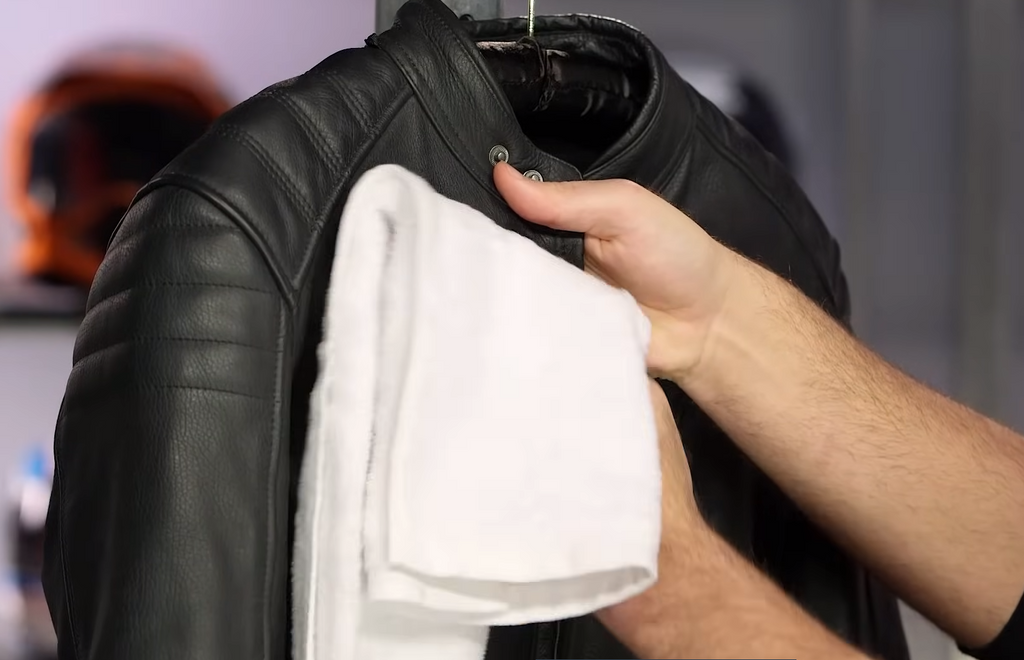A man Washing a Leather Jacket
