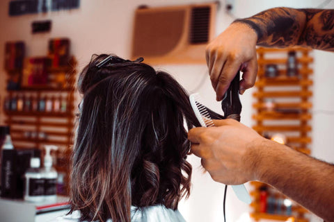 Get regular trims.  Trimming your hair every four to eight weeks is a good way to maintain hair health and keep your locks looking fresh. Take a half inch off the bottom to reduce the chances of developing dry, split ends.