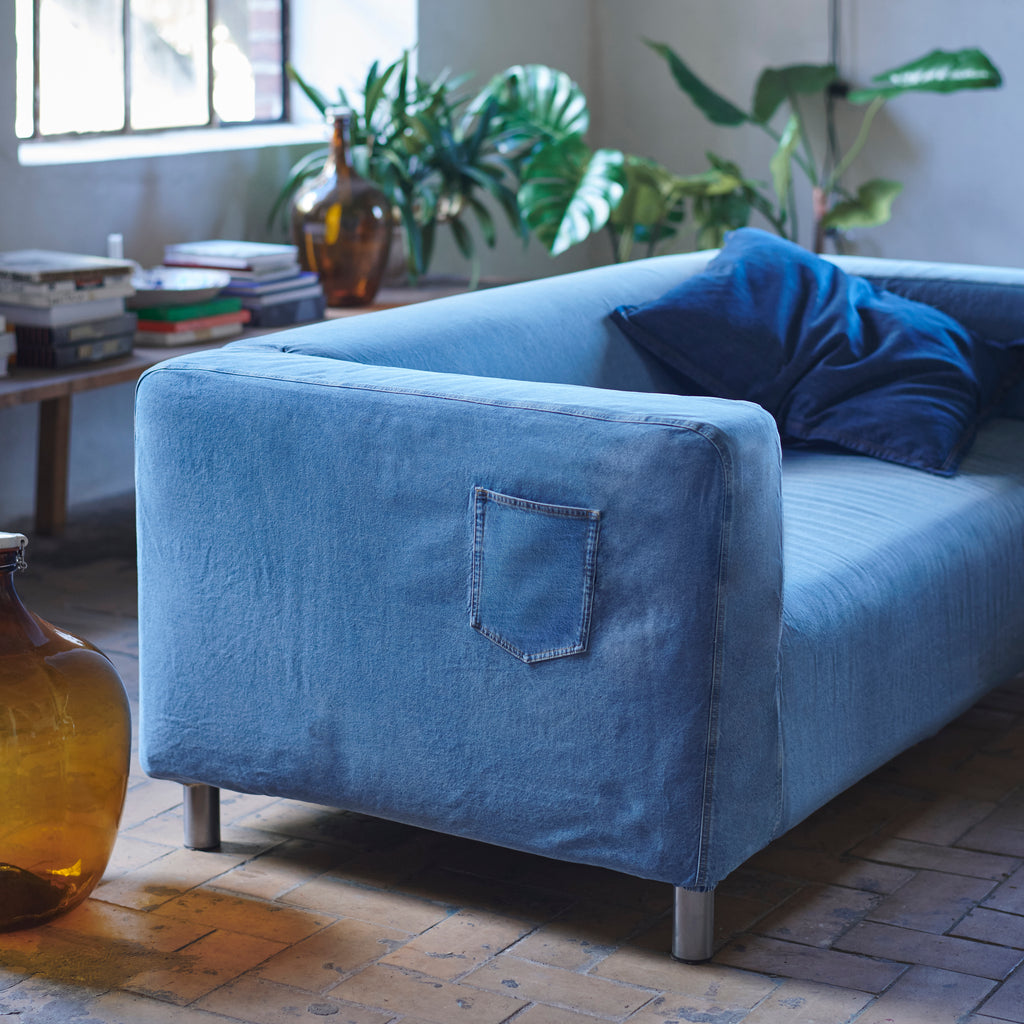 The IKEA KLIPPAN sofa in a circular denim cover by MUD Jeans