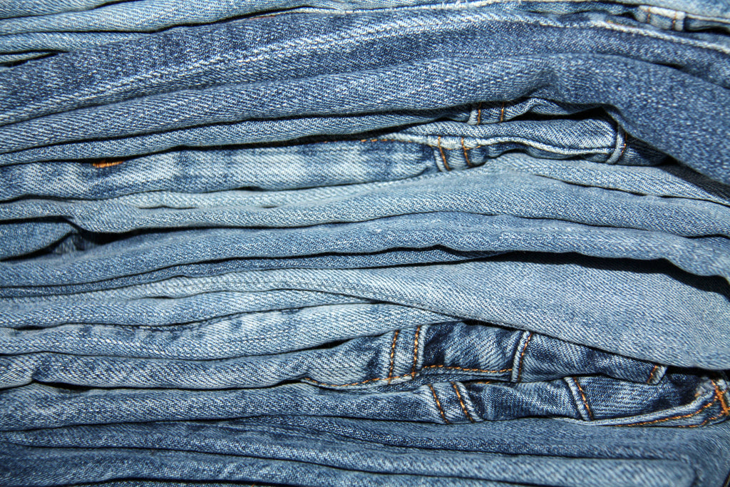 Pile of jeans in different shades