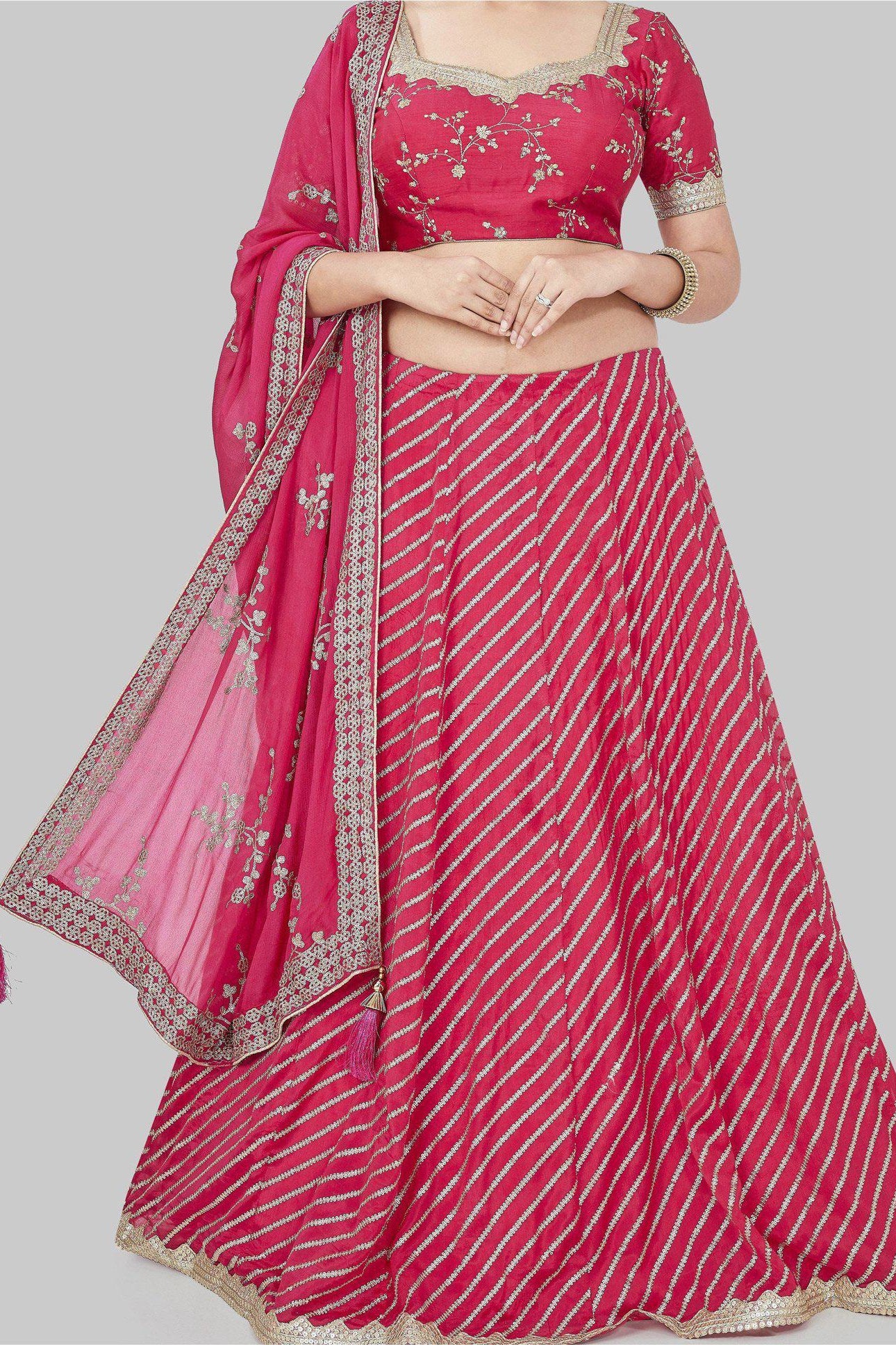 MULTI COLOURED PANELLED LEHENGA WITH A MIRROR EMBROIDERED PINK BLOUSE  PAIRED WITH A MATCHING BUTI WORK DUPATTA AND GOLD DETAILS. - Seasons India