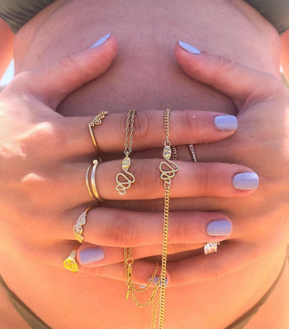 Snake jewellery laid on pregnant belly