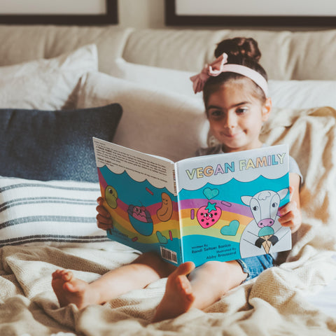 Little Girl Reading Vegan Family Children's Book
