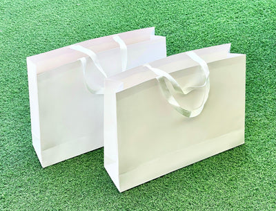 White Clothing/ Apparel bag with whie ribbon