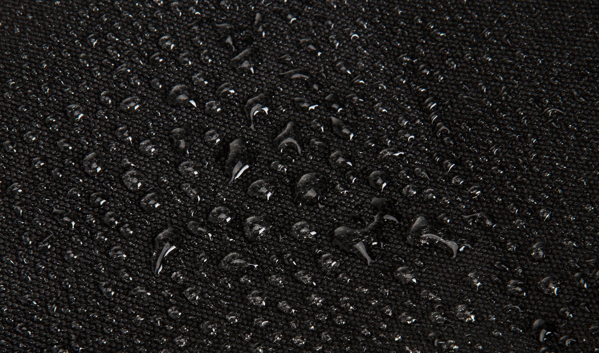 water resistant scuba material with water droplets