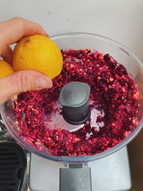 Fresh organic beetroot being blended with freshly squeezed lemon juice
