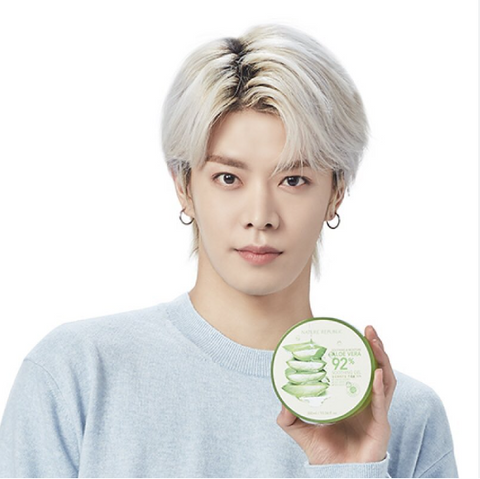 NCT 127 Yuta posing with Nature Republic Soothing & Moisture 99% Aloe Gel