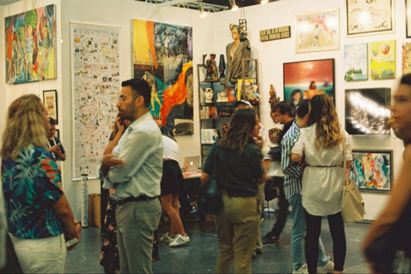 People viewing arts in a gallery