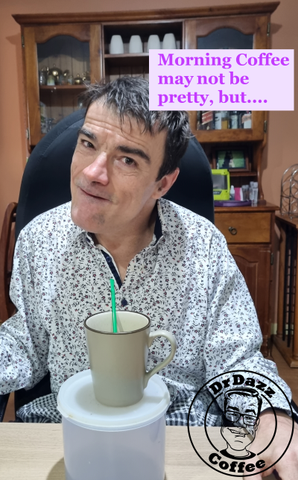 Dr Dazz sitting at table with mug of coffee and plastic straw with caption saying Morning coffee may not be pretty but ...