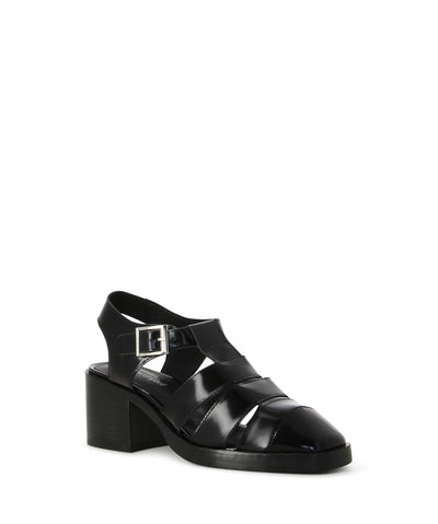 Heeled black leather fisherman sandals featuring a buckle fastening at the ankle, a block heel, multiple shiny leather straps, and a closed round toe.