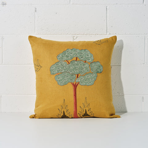 Beautiful tree motif embroidered on a mustard linen fabric to make a cushion cover - Agasti