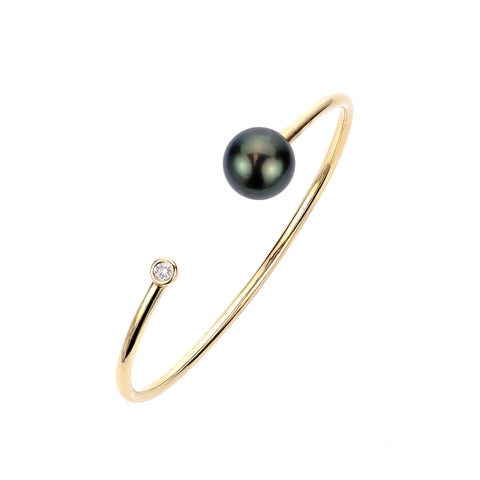 Cuff bracelet in 14k yellow gold with a Tahitian pearl and diamond accent by Imperial Pearl