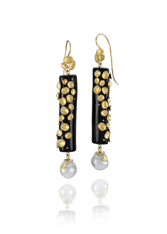 Drop Shell earrings in 18k gold with black coral and white South Sea pearls, $5,000; email terri@barbaraheinrichstudio.com for purchase