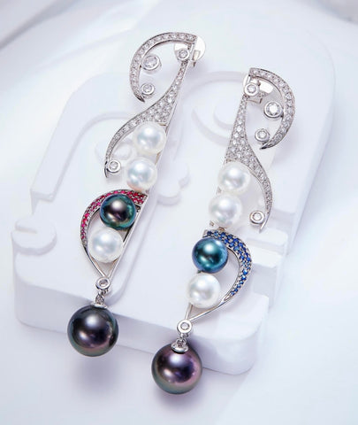 Melodic Embrace of Love earrings in 18k white gold with 8–8.5 mm akoya cultured pearls, 8.5 – 12.2 mm Tahitian cultured pearls, 2.2 cts. t.w. diamonds, rubies, and blue sapphires by Chaulri