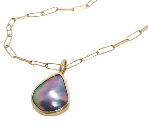 Pendant necklace in 14k yellow gold with a Sea of Cortez pearl, $1,440 ($740 for pendant alone); Ocean’s Cove Jewelry