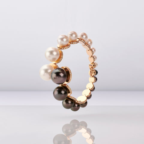 Double Line bracelet in 18k yellow gold with cultured white and black Tahitian South Sea pearls, 5.5–16 mm white and dyed black Akoya pearls, and 2.21 cts. t.w. white diamonds by Melanie Georgacopoulos of London