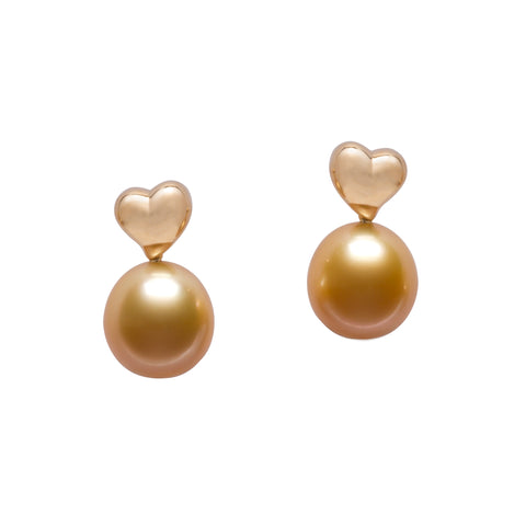 Heart-style earrings in 18k yellow gold with golden South Sea pearls are from the Petits Coeurs collection by Jewelmer. According to the brand, heart motifs symbolize love and meaningful connection and its passion for artistry and the planet. Email marion.branellec@jewelmer.com for purchase.