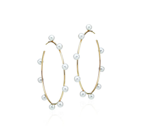 Large 60 mm hoops in 14k yellow gold with 6 mm freshwater pearls, $1,520; LexiMazz Designs