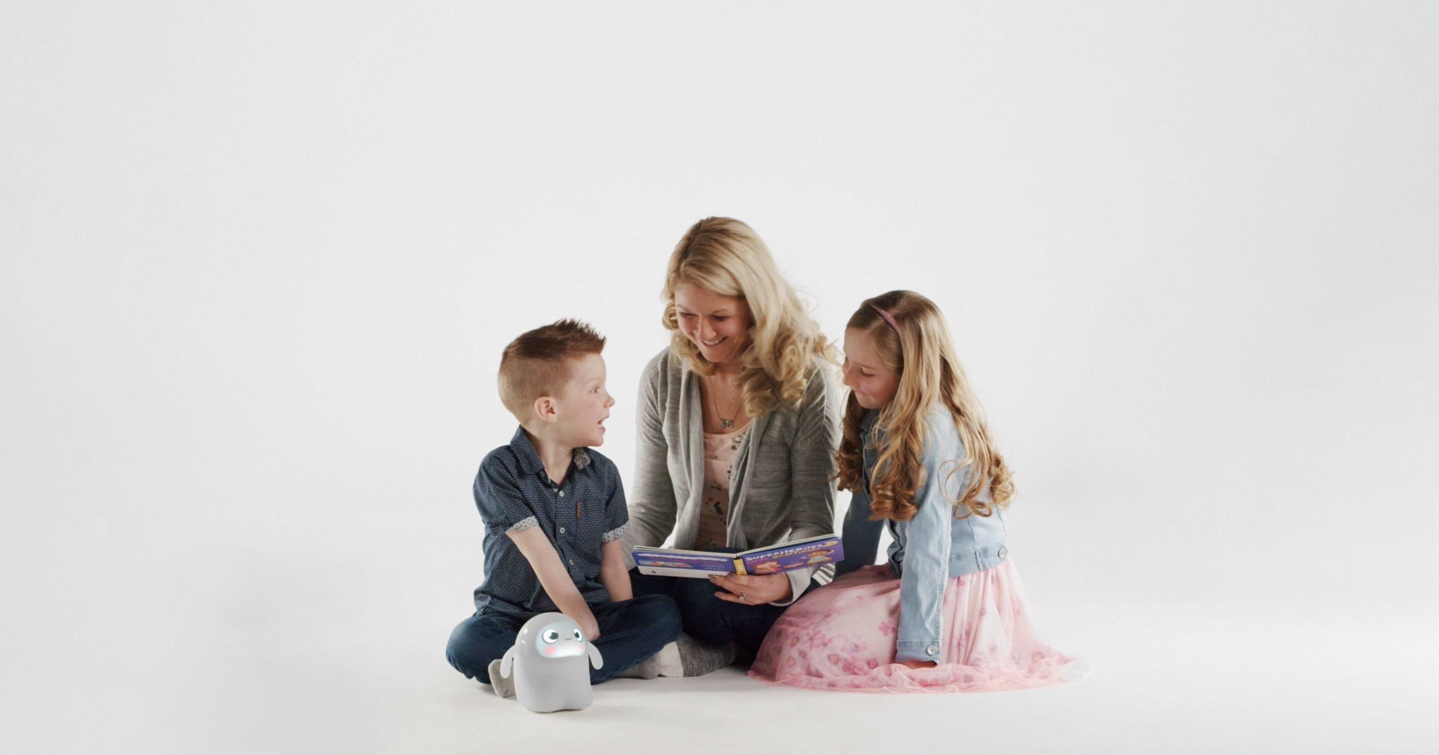 Mother reading to two children with Snorble®.