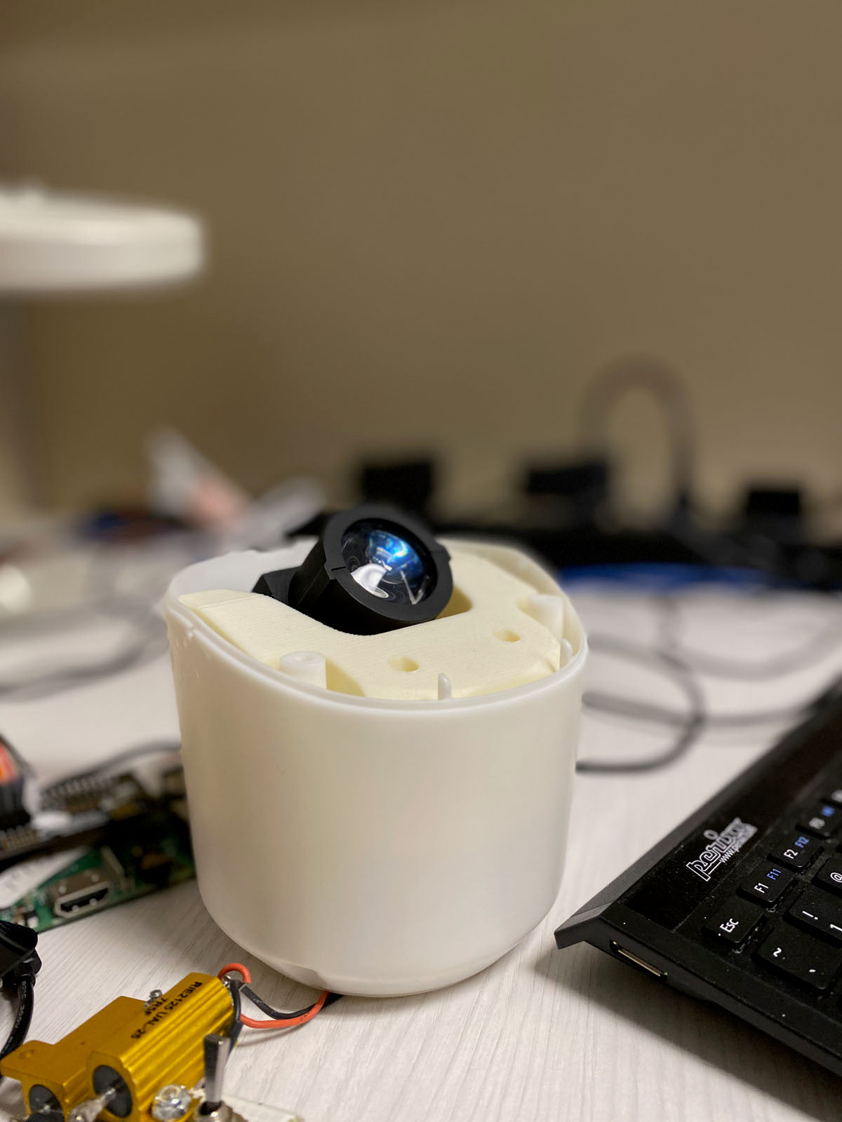 Image contains a photo of the custom projector made for Snorble, a sleep robot for children.