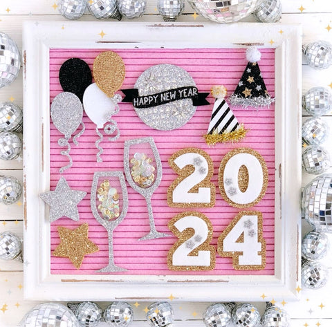 pink party decor felt message sign new years flatlay with handmade glitter accessories