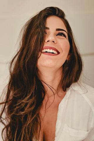 Woman smiling with makeup on