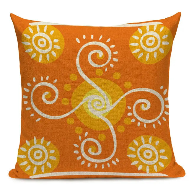 Orange throw pillow with a white and yellow sunburst pattern surrounded by swirling designs and circular motifs, inspired by traditional art 44555432100003