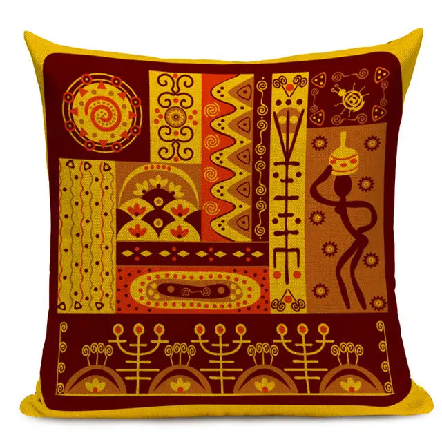 Golden and red throw pillow with a patchwork of traditional African designs, including female figure balancing jug on her headand intricate patterns 44555431379107