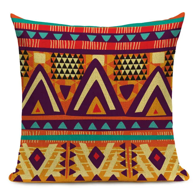Vibrant throw pillow with a multicolored geometric pattern featuring triangles and diamonds in bold colors of red, green, yellow, and black 44555431608483