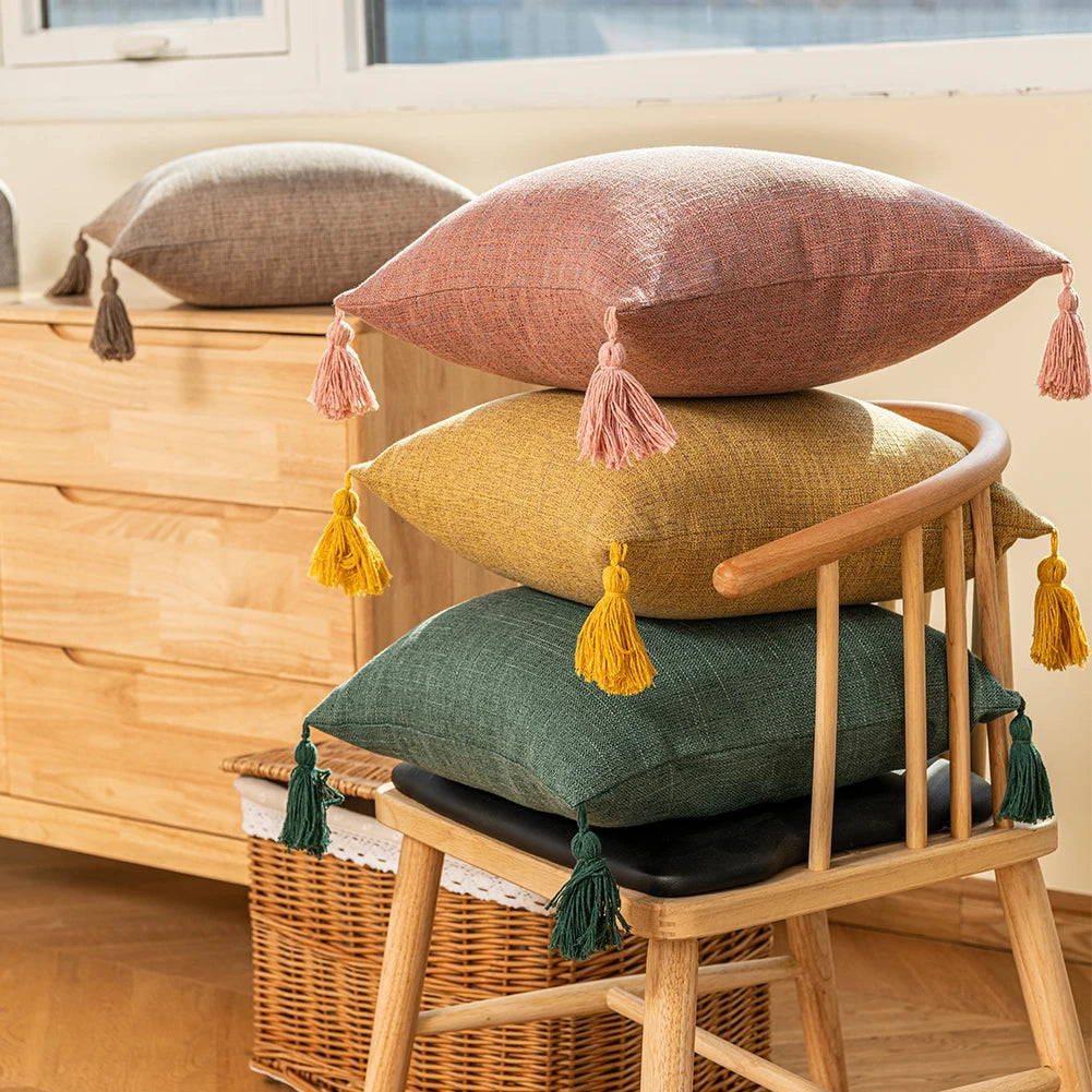 Green, Red and Mustard colored handmade Cotton Throw Pillow Covers on a pine wood chair