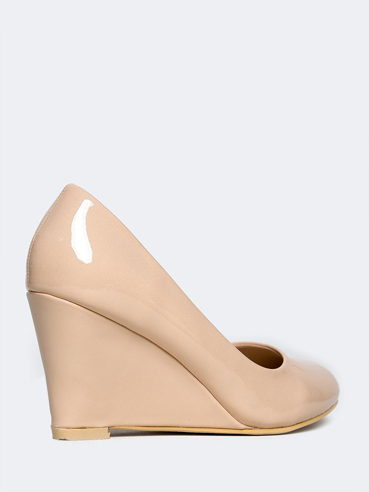 nude closed toe wedges