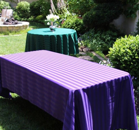 tables lined with linens at an event