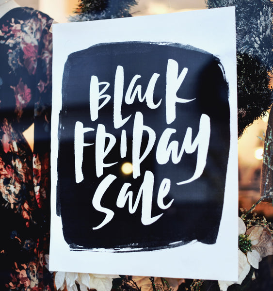 "Black Friday Sale" sign in a retail window. Photo: Tim Mossholder/Unsplash