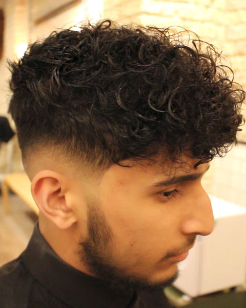 Low Skin Fade Curly Haircut With Disconnected Undercut Video