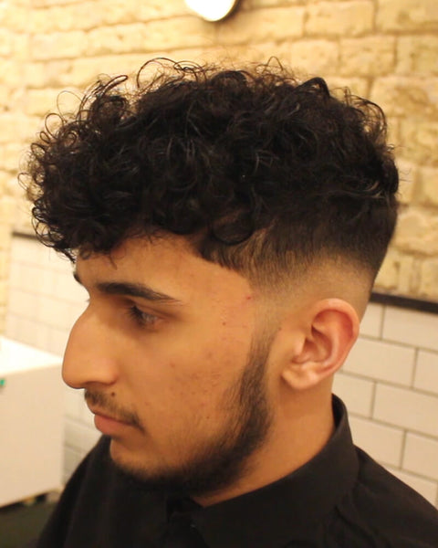 Low Skin Fade Curly Haircut With Disconnected Undercut Video