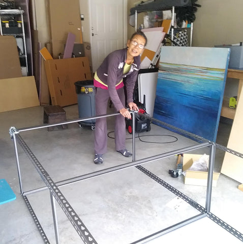 Assembling a shelf in the garage studio.