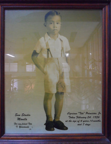 Cipriano Primicias Jr. at 4 years of age, wearing shorts with suspenders.