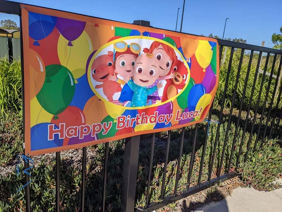 Cocomelon Party Banner on Fence
