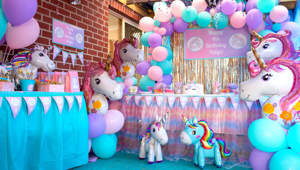 Unicorn Birthday Party Cake Table and Area