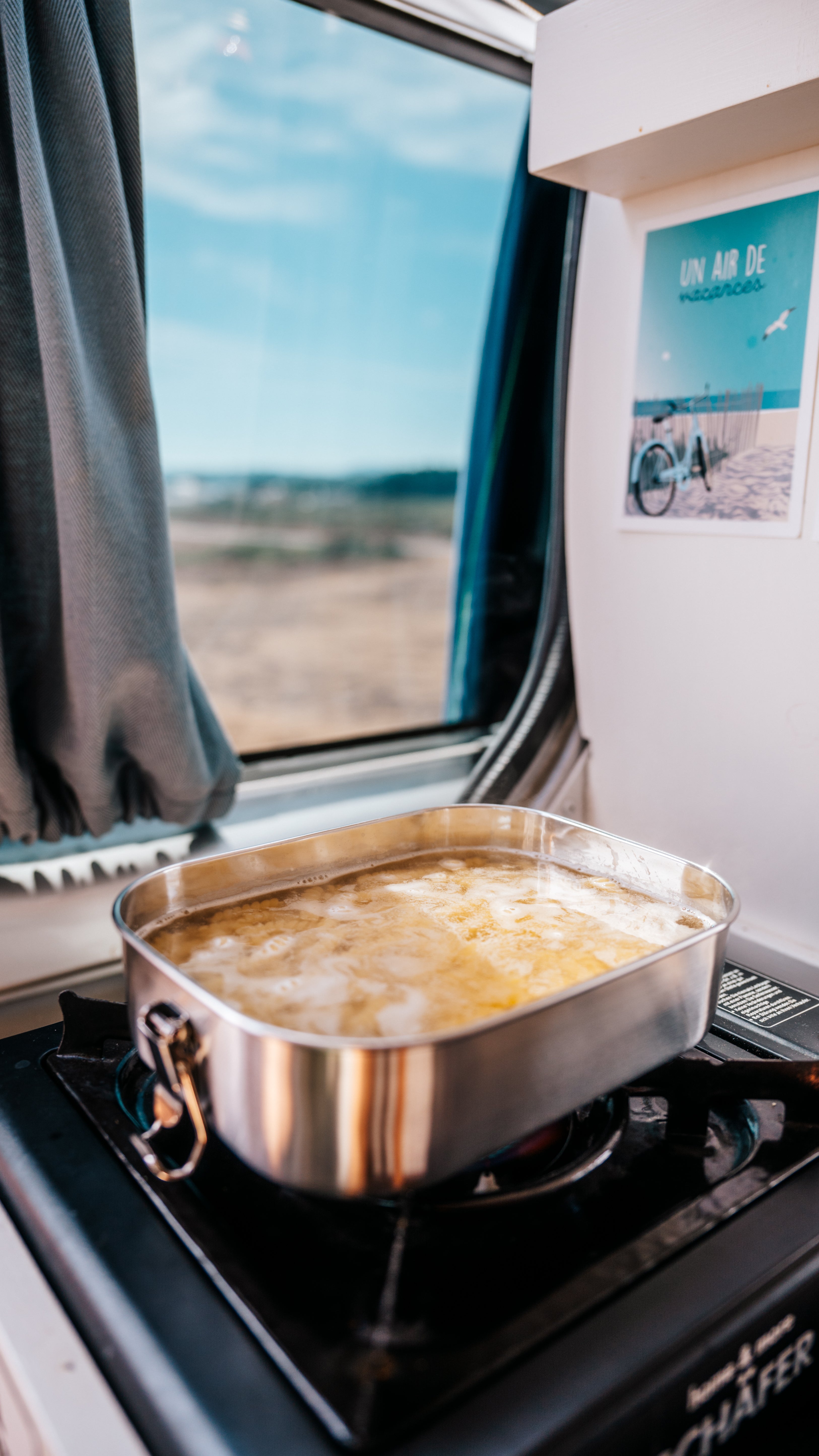 Pasta being cooked in Blockhuette stainless steel lunch box on a gas stove