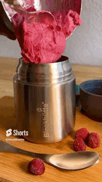 Ice cream being filled into Blockhuette stainless steel insulated food jar
